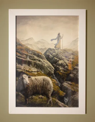 The Found Sheep: Jesus Christ standing on a hill having found one of His lost sheep.