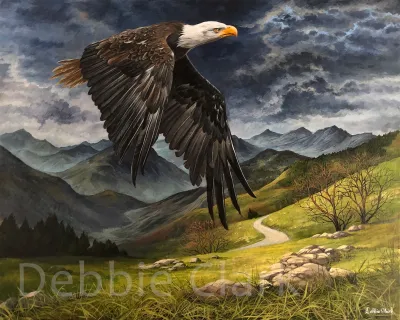 Strength of an Eagle: A bald eagle flying over a mountainous landscape.