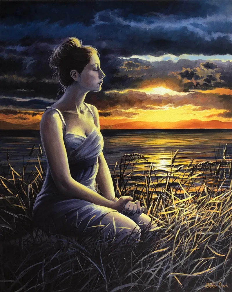 Time for Healing: A woman in a meditative and prayerful state as the sun goes down. After a long struggle, she has found peace in the surrendering of her heart to Jesus Christ.