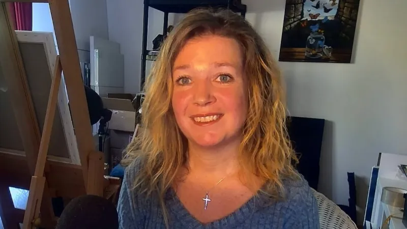 Debbie Clark in her studio, telling her testimony